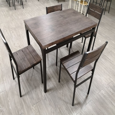 La table de salle à manger noire en bois à la maison a placé 4 chaises de Seater avec le cadre en métal